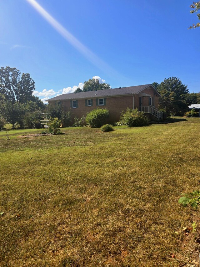 exterior space featuring a front lawn