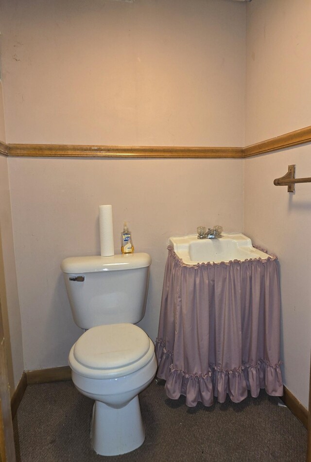 bathroom featuring toilet