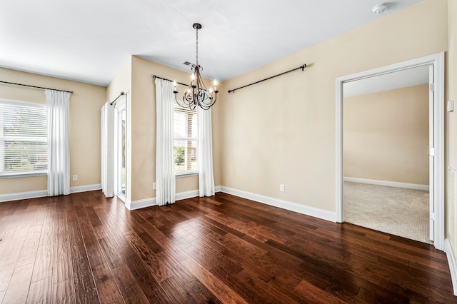 interior space featuring a chandelier and dark hardwood / wood-style flooring