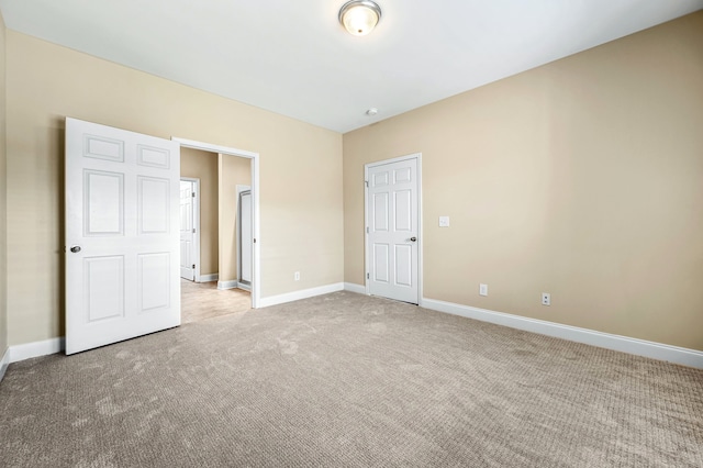 unfurnished bedroom with light carpet