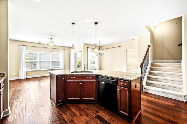 kitchen with black dishwasher, light stone counters, dark hardwood / wood-style floors, sink, and a kitchen island