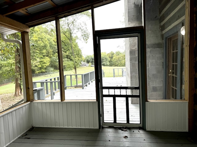 entryway featuring wood walls and wood-type flooring