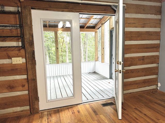 doorway to outside featuring hardwood / wood-style floors