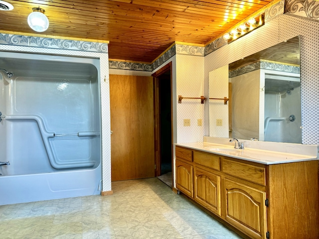 bathroom featuring washtub / shower combination, vanity, and wood ceiling