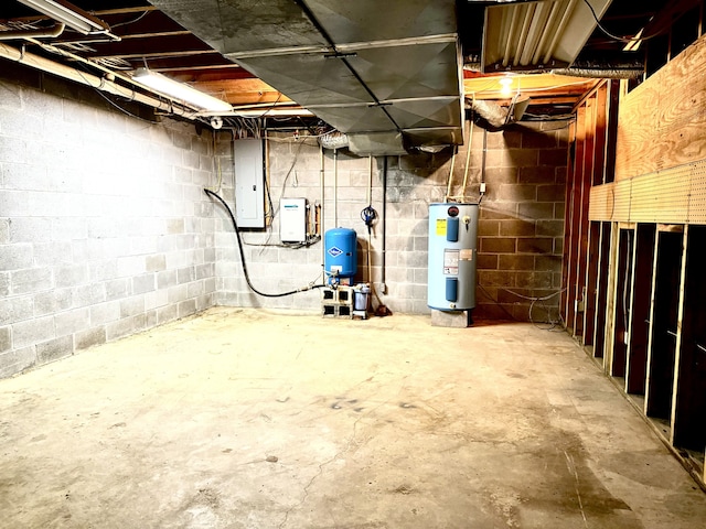 basement with electric water heater and electric panel