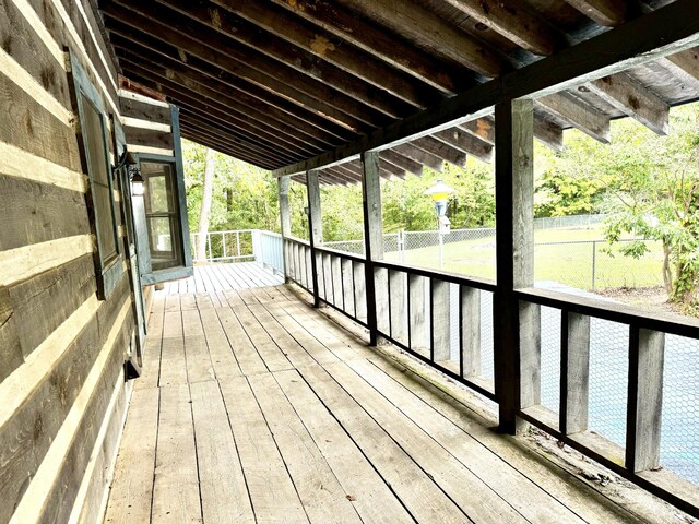 wooden deck featuring fence
