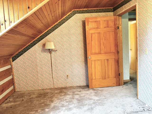 additional living space with carpet, vaulted ceiling, and wooden ceiling