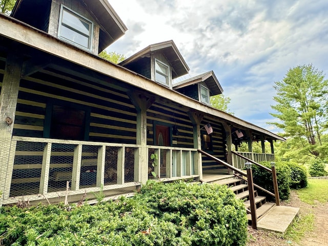 view of property exterior featuring covered porch