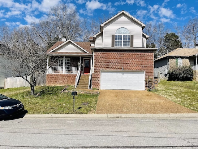 view of front of house featuring a porch, a garage, and a front yard