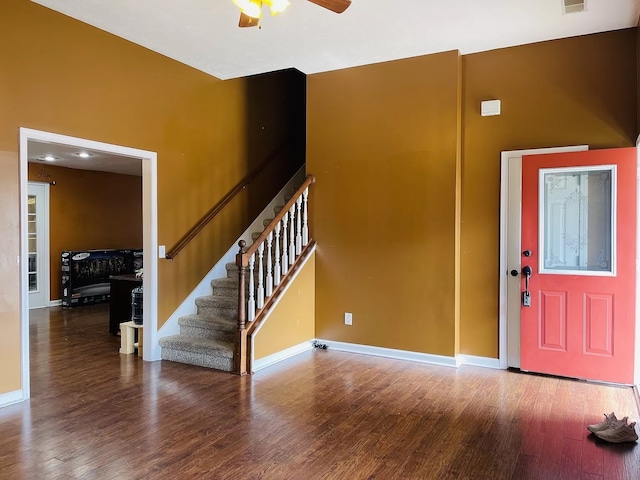 foyer with ceiling fan and dark hardwood / wood-style floors