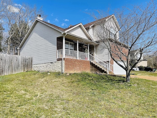 view of front facade featuring a front lawn and covered porch