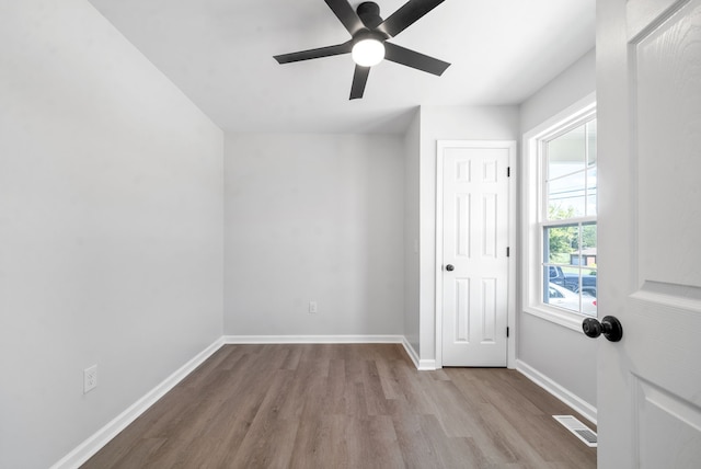 interior space featuring light hardwood / wood-style floors and ceiling fan