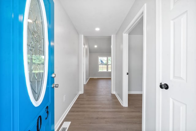 entryway with hardwood / wood-style flooring