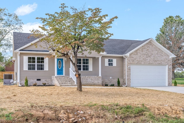 ranch-style home with cooling unit and a garage