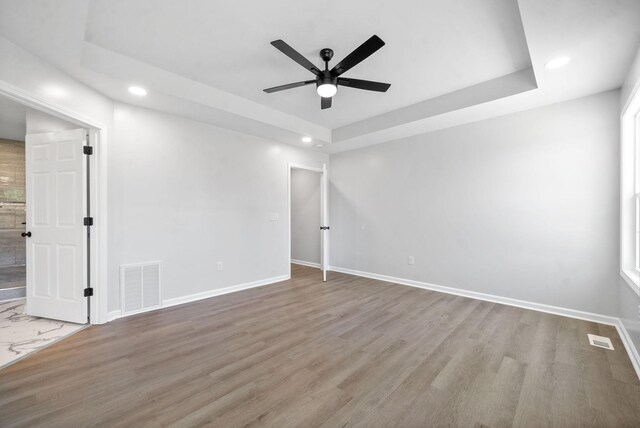 spare room with ceiling fan and light hardwood / wood-style flooring