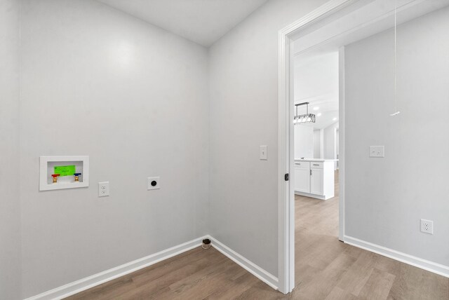 laundry area with washer hookup, a notable chandelier, hardwood / wood-style floors, and hookup for an electric dryer