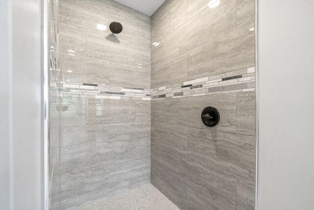 bathroom with a tile shower