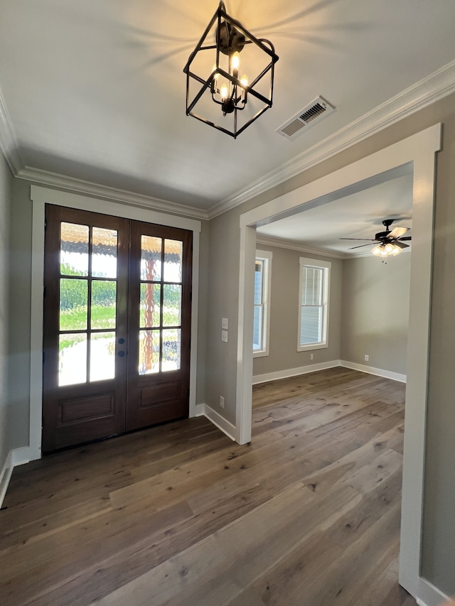 doorway to outside with ornamental molding, ceiling fan with notable chandelier, french doors, and dark hardwood / wood-style flooring