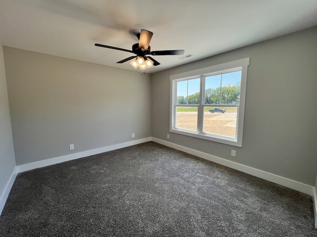 carpeted empty room featuring ceiling fan