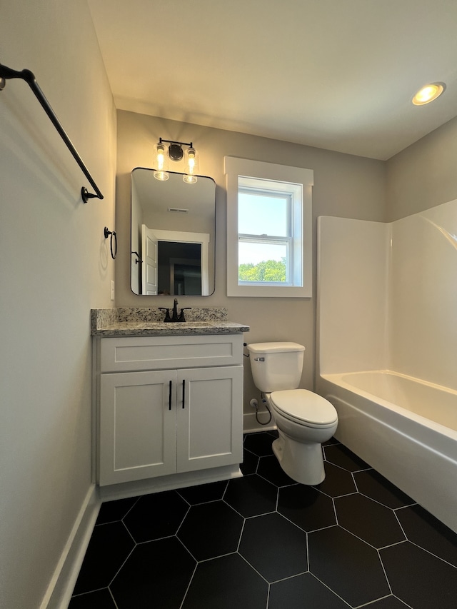 full bathroom featuring tile patterned floors, shower / bath combination, vanity, and toilet