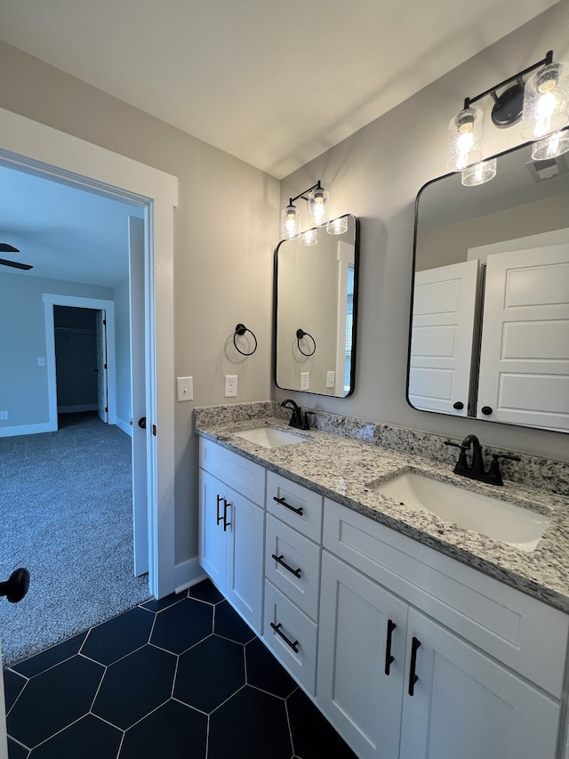 bathroom with tile patterned flooring and vanity