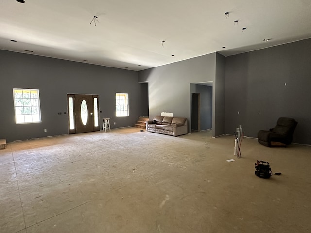 unfurnished living room featuring a wealth of natural light