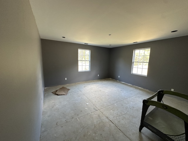 spare room with plenty of natural light