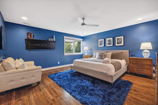 bedroom featuring ceiling fan and dark hardwood / wood-style floors