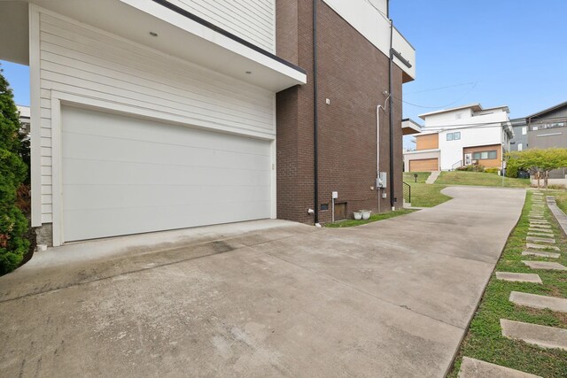 view of side of home featuring a garage