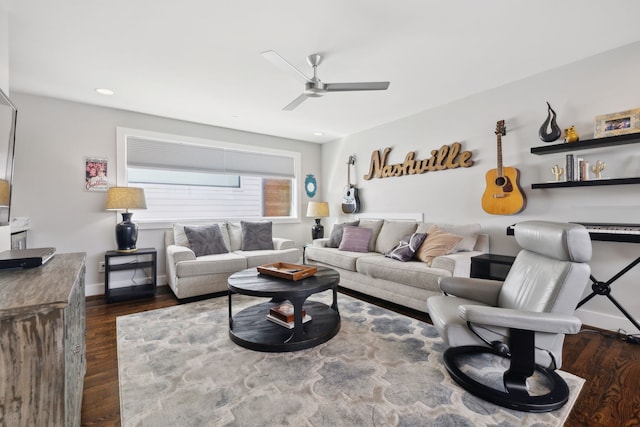 living room with ceiling fan and dark hardwood / wood-style flooring