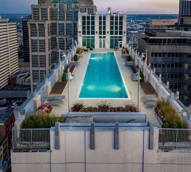 view of pool at dusk