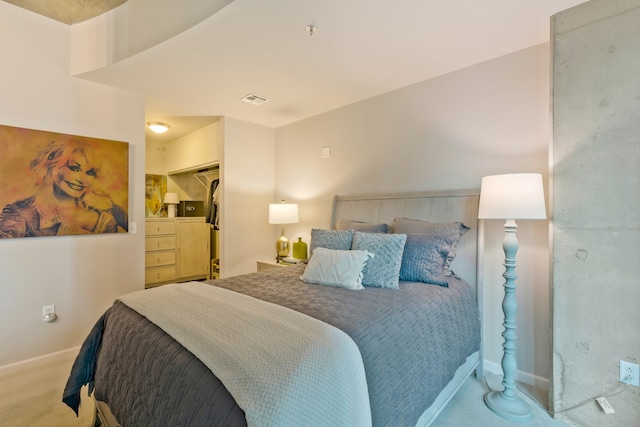 carpeted bedroom with a closet