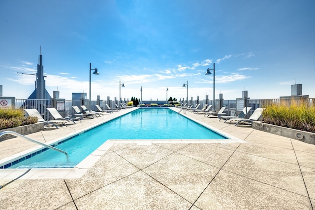 view of swimming pool featuring a patio area