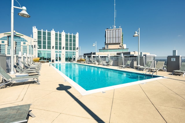 view of swimming pool featuring a patio area