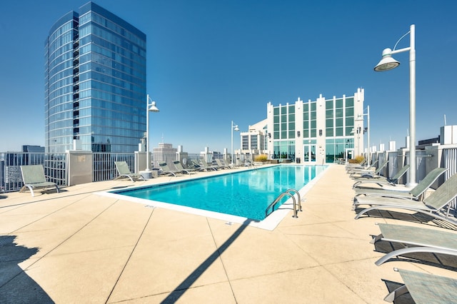 view of swimming pool featuring a patio