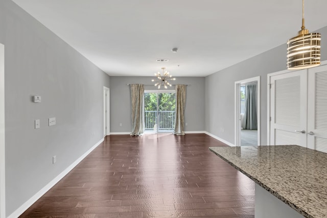 interior space with an inviting chandelier and dark wood-type flooring