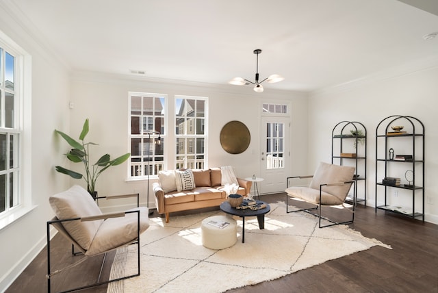 living room with crown molding, dark hardwood / wood-style flooring, and a wealth of natural light