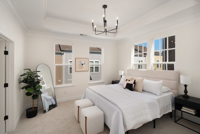 carpeted bedroom featuring ornamental molding, a chandelier, and a raised ceiling