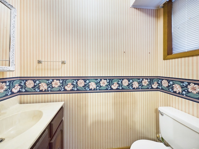 bathroom with vanity and toilet