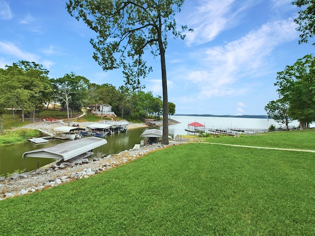 view of yard with a boat dock and a water view