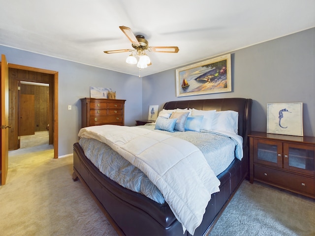 bedroom featuring ceiling fan and carpet