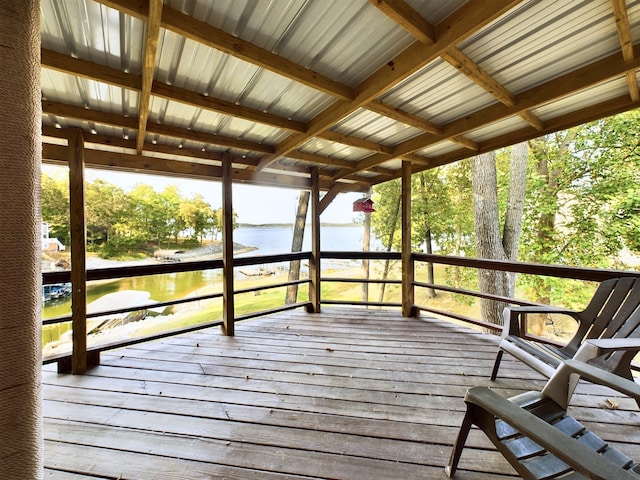 wooden deck featuring a water view