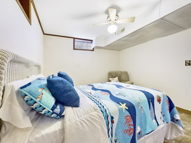 bedroom featuring ornamental molding and ceiling fan