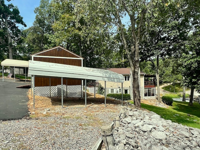 view of side of property featuring a carport