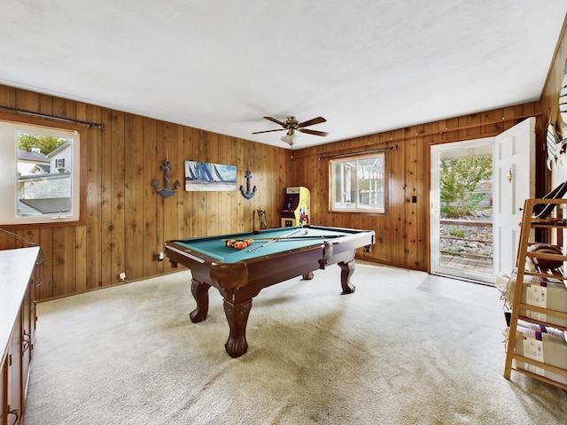 playroom with wooden walls, ceiling fan, billiards, and plenty of natural light