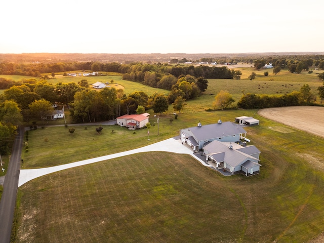 birds eye view of property with a rural view