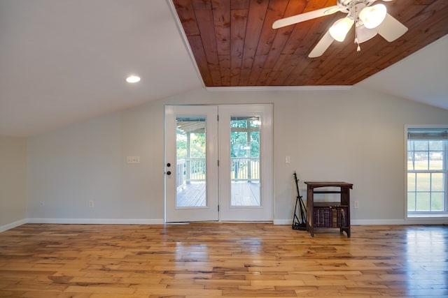 entryway featuring ceiling fan, light hardwood / wood-style flooring, vaulted ceiling, and a healthy amount of sunlight