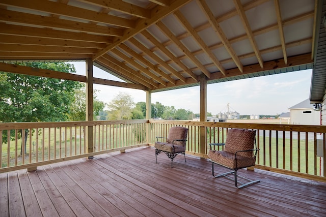 wooden deck featuring a yard