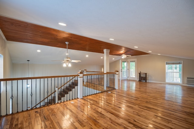 spare room with wood ceiling, lofted ceiling, ceiling fan, and hardwood / wood-style flooring