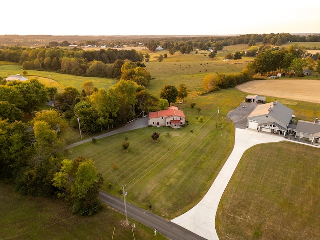 birds eye view of property with a rural view